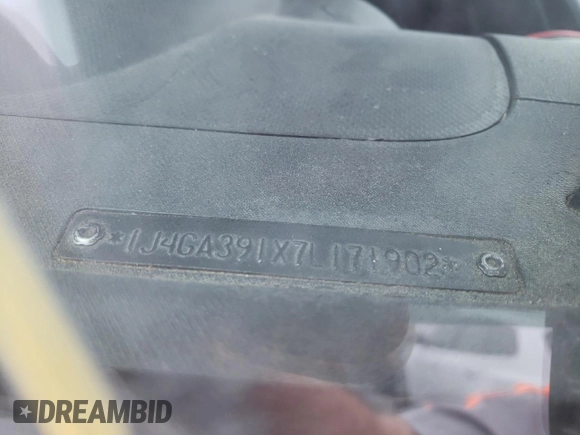2007 Jeep Wrangler Unlimited X with VIN 1J4GA391X7L171902, listed as a Copart auction lot 82150334 with 167,695 mi miles and Salvage title. Bid and sale history available at DreamBid. Image 12.