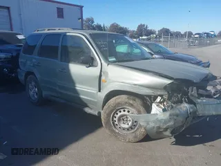 2003 Mazda Tribute ES with VIN 4F2CZ96123KM11822, listed as a IAAI auction lot 41279605 with 128,749 mi miles. Bid and sale history available at carsss.com. Image 1.