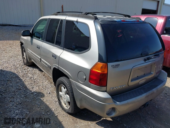 2003 GMC Envoy SLT z VIN 1GKDS13S932106295, wystawiony jako IAAI lot #41594814 z przebiegiem 199 597 mil mil oraz . Historia ofert i sprzedaży dostępna na DreamBid. Obrazek 6.