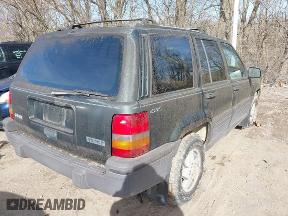 1993 Jeep Grand Cherokee Laredo with VIN 1J4GZ58S1PC680016, listed as a IAAI auction lot 41813392 with 149,520 mi miles. Bid and sale history available at carsss.com. Image 4.