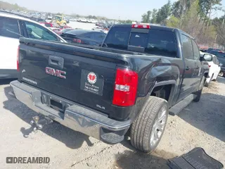 2015 GMC Sierra 1500 SLE with VIN 3GTU2UEC9FG338474, listed as a IAAI auction lot 41899379 with 140,859 mi miles. Bid and sale history available at carsss.com. Image 4.