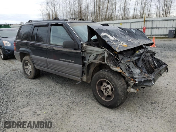 1996 Jeep Grand Cherokee Laredo with VIN 1J4GZ58S2TC174270, listed as a Copart auction lot 49924815 with 0 mi miles and Salvage Title. Bid and sale history available at carsss.com. Image 4.
