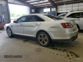 2014 Ford Taurus SEL z VIN 1FAHP2E86EG128370, wystawiony jako Copart lot #58216645 z przebiegiem 95 488 mil mil oraz Tytuł czysty. Historia ofert i sprzedaży dostępna na DreamBid. Obrazek 2.