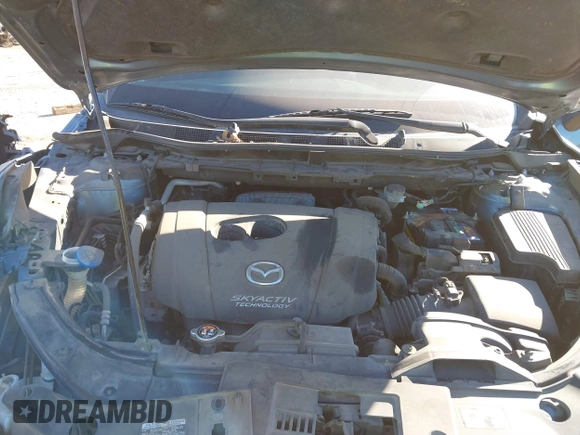 2016 Mazda CX-5 Sport with VIN JM3KE2BY3G0641895, listed as a IAAI auction lot 41689138 with 121,636 mi miles and . Bid and sale history available at DreamBid. Image 10.