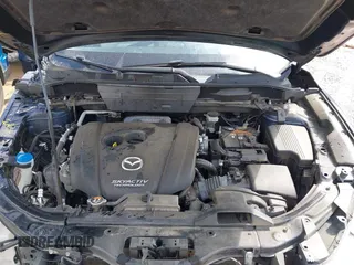 2018 Mazda CX-5 Grand Touring z VIN JM3KFADM8J1406007, wystawiony jako IAAI lot #42008567 z przebiegiem 110 661 mil mil oraz . Historia ofert i sprzedaży dostępna na DreamBid. Obrazek 10.
