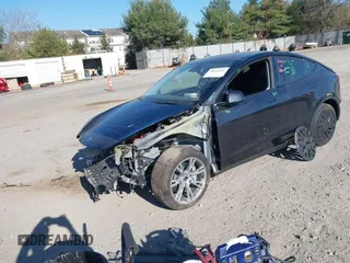2024 Tesla Model Y with VIN 7SAYGDED3RF092501, listed as a IAAI auction lot 40820923 with 4,688 mi miles and . Bid and sale history available at DreamBid. Image 2.