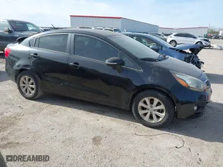 2013 Kia Rio EX with VIN KNADN4A39D6096262, listed as a IAAI auction lot 41094665 with 120,919 mi miles. Bid and sale history available at carsss.com. Image 1.