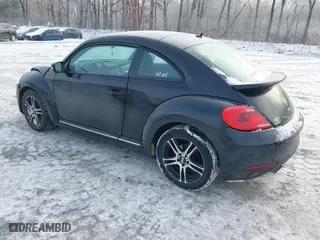 2012 Volkswagen Beetle 2.5L PZEV with VIN 3VWJP7AT8CM619137, listed as a IAAI auction lot 41195954 with 157,741 mi miles. Bid and sale history available at carsss.com. Image 3.