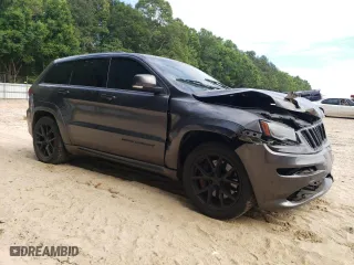 2015 Jeep Grand Cherokee SRT with VIN 1C4RJFDJ9FC842448, listed as a Copart auction lot 56956284 with 178,141 mi miles and Salvage Title. Bid and sale history available at carsss.com. Image 4.