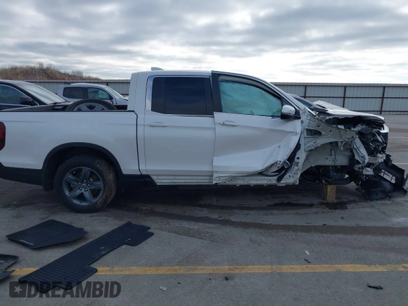 2023 Honda Ridgeline RTL with VIN 5FPYK3F55PB018188, listed as a IAAI auction lot 41952319 with 73,019 mi miles and . Bid and sale history available at DreamBid. Image 13.