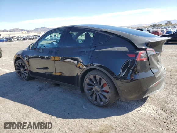 2023 Tesla Model Y Performance with VIN 7SAYGDEF7PF924355, listed as a Copart auction lot 47877055 with 64,663 mi miles and Salvage Title. Bid and sale history available at DreamBid. Image 2.