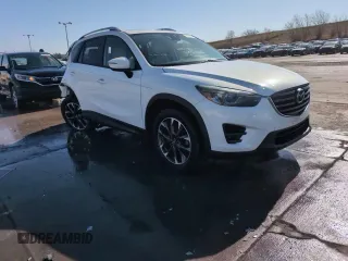 2016 Mazda CX-5 Grand Touring with VIN JM3KE4DY8G0671256, listed as a Copart auction lot 52920975 with 87,822 mi miles and Non Repairable. Bid and sale history available at carsss.com. Image 14.