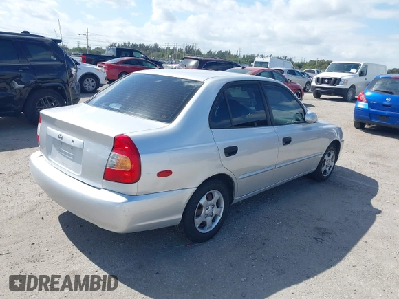 2002 Hyundai Accent GL with VIN KMHCG45C82U268756, listed as a IAAI auction lot 41569829 with 89,752 mi miles. Bid and sale history available at carsss.com. Image 4.