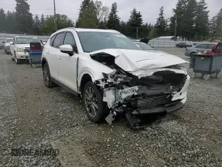 2021 Mazda CX-5 Signature with VIN JM3KFBEY3M0410998, listed as a Copart auction lot 54868885 with 73,207 mi miles and Salvage Title. Bid and sale history available at carsss.com. Image 14.