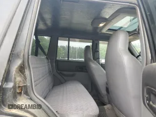 1998 Jeep Cherokee Sport z VIN 1J4FJ68S8WL183519, wystawiony jako Copart lot #60976335 z przebiegiem 161 536 mil mil oraz Czysty tytuł • Clean title. Historia ofert i sprzedaży dostępna na DreamBid. Obrazek 11.
