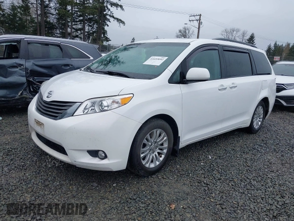 2014 Toyota Sienna XLE with VIN 5TDYK3DC2ES485846, listed as a IAAI auction lot 41693092 with 106,156 mi miles and . Bid and sale history available at DreamBid. Image 2.