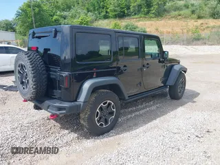 2017 Jeep Wrangler Unlimited Rubicon Recon z VIN 1C4HJWFG4HL507601, wystawiony jako IAAI lot #42258921 z przebiegiem 106 122 mil mil oraz . Historia ofert i sprzedaży dostępna na DreamBid. Obrazek 4.