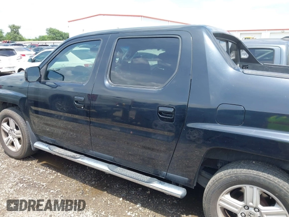 2011 Honda Ridgeline RTL with VIN 5FPYK1F54BB011472, listed as a IAAI auction lot 42112512 with 194,974 mi miles and . Bid and sale history available at DreamBid. Image 14.