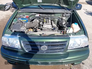 2001 Suzuki Vitara JX z VIN 2S3TD52V416109787, wystawiony jako IAAI lot #42126699 z przebiegiem Nie podano mil oraz . Historia ofert i sprzedaży dostępna na DreamBid. Obrazek 10.