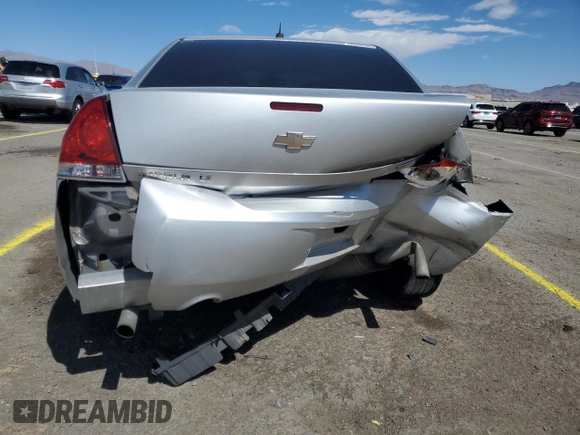 2014 Chevrolet Impala LT with VIN 2G1WB5E3XE1184419, listed as a Copart auction lot 51473045 with 98,299 mi miles and Salvage Title. Bid and sale history available at DreamBid. Image 6.