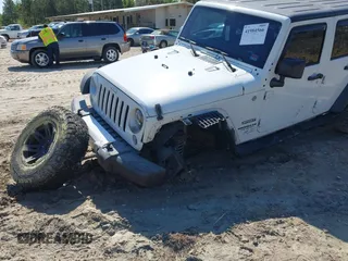 2015 Jeep Wrangler Unlimited Willys Wheeler with VIN 1C4BJWDG0FL546000, listed as a IAAI auction lot 41984566 with 112,742 mi miles and . Bid and sale history available at DreamBid. Image 6.
