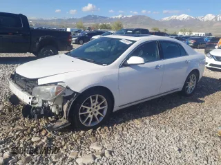 2012 Chevrolet Malibu LTZ with VIN 1G1ZG5E7XCF122655, listed as a Copart auction lot 54619015 with 164,118 mi miles and Salvage Title. Bid and sale history available at DreamBid. Image 1.
