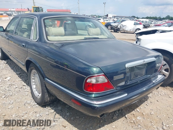 1999 Jaguar XJ with VIN SAJKD6048XC869099, listed as a IAAI auction lot 42761055 with 124,326 mi miles and . Bid and sale history available at DreamBid. Image 3.