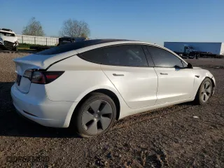 2021 Tesla Model 3 Standard Range Plus with VIN 5YJ3E1EA9MF100403, listed as a Copart auction lot 48561545 with 68,996 mi miles and Salvage Title. Bid and sale history available at carsss.com. Image 3.