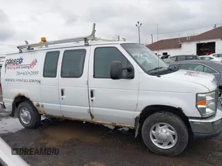 2011 Ford Econoline Cargo Commercial with VIN 1FTNE1EW1BDA17492, listed as a IAAI auction lot 41036647 with 242,810 mi miles and . Bid and sale history available at DreamBid. Image 13.