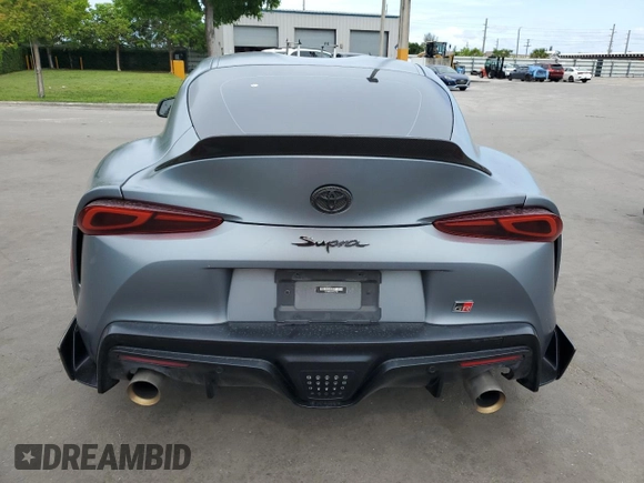 2022 Toyota Supra 3.0 with VIN WZ1DB0C09NW047931, listed as a Copart auction lot 59527955 with 61,941 mi miles and Salvage title. Bid and sale history available at DreamBid. Image 6.