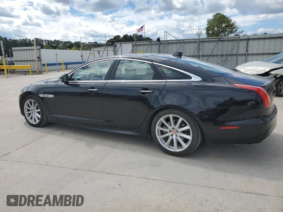 2018 Jaguar XJ with VIN SAJWA1C76J8W14271, listed as a Copart auction lot 73777914 with 124,155 mi miles and Salvage Title. Bid and sale history available at carsss.com. Image 2.