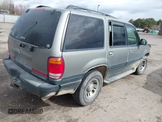 1999 Mercury Mountaineer z VIN 4M2ZU55P9XUJ19323, wystawiony jako IAAI lot #41815135 z przebiegiem 231 715 mil mil oraz . Historia ofert i sprzedaży dostępna na DreamBid. Obrazek 4.