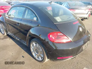 2012 Volkswagen Beetle 2.5L w/Sound/Nav PZEV with VIN 3VWJP7AT7CM661055, listed as a IAAI auction lot 41980159 with 113,678 mi miles and . Bid and sale history available at DreamBid. Image 3.