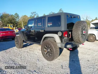 2015 Jeep Wrangler Unlimited Rubicon with VIN 1C4BJWFGXFL610153, listed as a IAAI auction lot 41575401 with 114,583 mi miles. Bid and sale history available at carsss.com. Image 3.