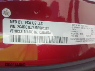 2021 Chrysler Pacifica Hybrid Touring L with VIN 2C4RC1L76MR581285, listed as a IAAI auction lot 42303222 with 77,808 mi miles and . Bid and sale history available at DreamBid. Image 9.