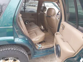 1997 Oldsmobile Bravada with VIN 1GHDT13W2V2706505, listed as a IAAI auction lot 41835475 with 131,247 mi miles. Bid and sale history available at carsss.com. Image 8.