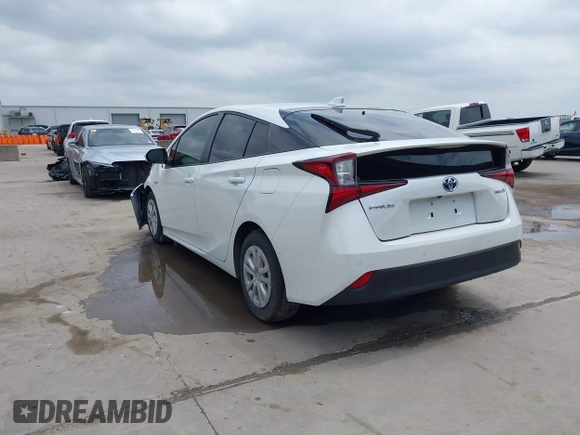 2022 Toyota Prius L Eco with VIN JTDKAMFUXN3157225, listed as a IAAI auction lot 39292379 with 59,333 mi miles and . Bid and sale history available at DreamBid. Image 3.