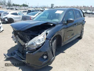 2016 Mazda CX-5 Grand Touring z VIN JM3KE2DY6G0900005, wystawiony jako IAAI lot #42311162 z przebiegiem 80 758 mil mil oraz . Historia ofert i sprzedaży dostępna na DreamBid. Obrazek 2.