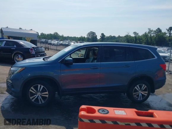2018 Honda Pilot EX-L with VIN 5FNYF6H52JB050535, listed as a IAAI auction lot 42576721 with 99,280 mi miles and . Bid and sale history available at DreamBid. Image 14.
