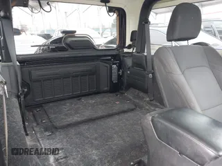2021 Jeep Wrangler Sport with VIN 1C4GJXAN5MW627228, listed as a IAAI auction lot 42170010 with 56,965 mi miles and . Bid and sale history available at DreamBid. Image 8.