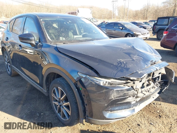 2017 Mazda CX-5 Grand Touring with VIN JM3KFBDL0H0104806, listed as a IAAI auction lot 41621964 with 60,728 mi miles. Bid and sale history available at carsss.com. Image 19.