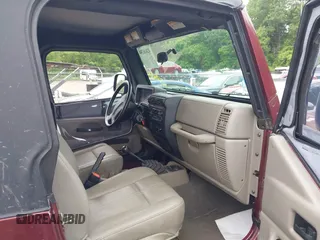 2004 Jeep Wrangler SE with VIN 1J4FA291X4P720783, listed as a IAAI auction lot 42446334 with 69,672 mi miles and . Bid and sale history available at DreamBid. Image 5.