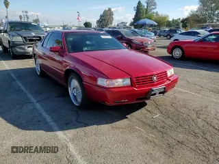 1999 Cadillac Eldorado Touring z VIN 1G6ET1293XU611368, wystawiony jako Copart lot #82683114 z przebiegiem 126 178 mil mil oraz Szkody całkowita. Historia ofert i sprzedaży dostępna na DreamBid. Obrazek 10.