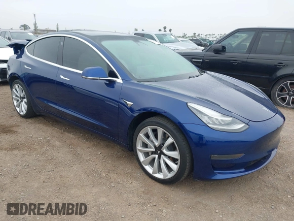 2020 Tesla Model 3 Standard Range Plus with VIN 5YJ3E1EA1LF802648, listed as a IAAI auction lot 42208034 with 27,231 mi miles and . Bid and sale history available at DreamBid. Image 1.