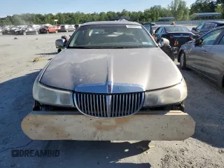 1999 Lincoln Town Car Signature z VIN 1LNHM82W7XY626305, wystawiony jako Copart lot #58009475 z przebiegiem Nie podano mil oraz Szkoda całkowita • Salvage title. Historia ofert i sprzedaży dostępna na DreamBid. Obrazek 5.