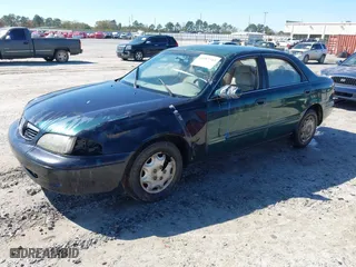 1999 Mazda 626 ES with VIN 1YVGF22C2X5859646, listed as a IAAI auction lot 41887343 with 1 mi miles. Bid and sale history available at carsss.com. Image 2.