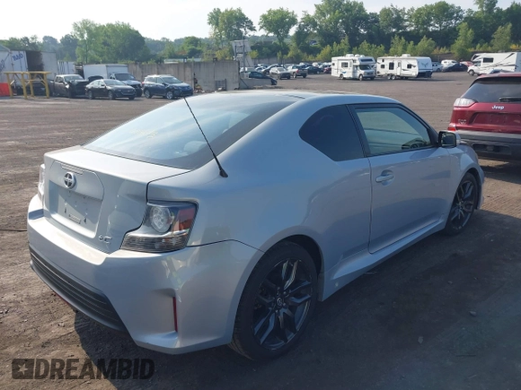 2014 Scion tC with VIN JTKJF5C78E3072572, listed as a IAAI auction lot 39680670 with 112,584 mi miles. Bid and sale history available at carsss.com. Image 4.