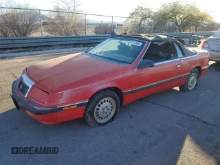 1989 Chrysler LeBaron z VIN 1C3XJ45K0KG251502, wystawiony jako Copart lot #87112404 z przebiegiem 166 445 mil mil oraz Tytuł czysty. Historia ofert i sprzedaży dostępna na DreamBid. Obrazek 1.