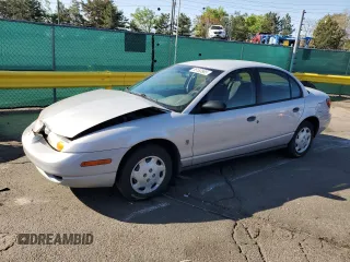 2001 Saturn SL z VIN 1G8ZH52891Z317279, wystawiony jako Copart lot #55163885 z przebiegiem 136 029 mil mil oraz Nie do naprawy • Non repairable. Historia ofert i sprzedaży dostępna na DreamBid. Obrazek 1.
