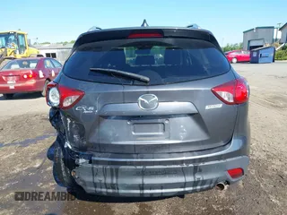 2014 Mazda CX-5 Grand Touring with VIN JM3KE4DY2E0312952, listed as a IAAI auction lot 42138721 with 99,993 mi miles and . Bid and sale history available at DreamBid. Image 16.